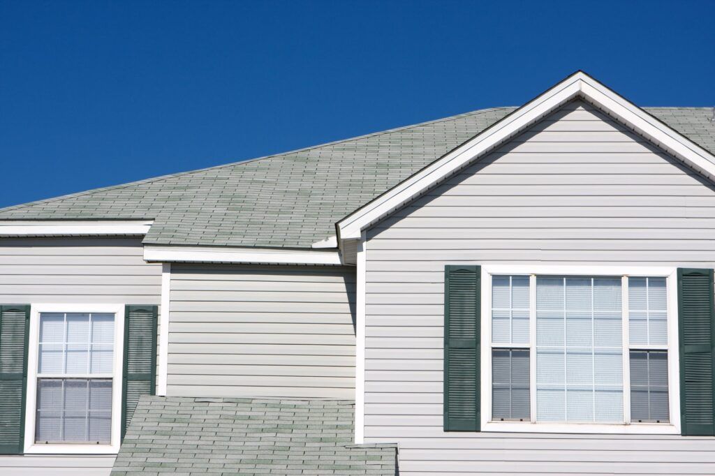 Fortress Roofing Calgary home with siding and shingles on roof